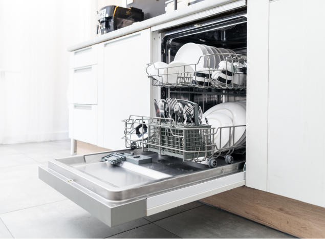 dishwasher open with plates stacked